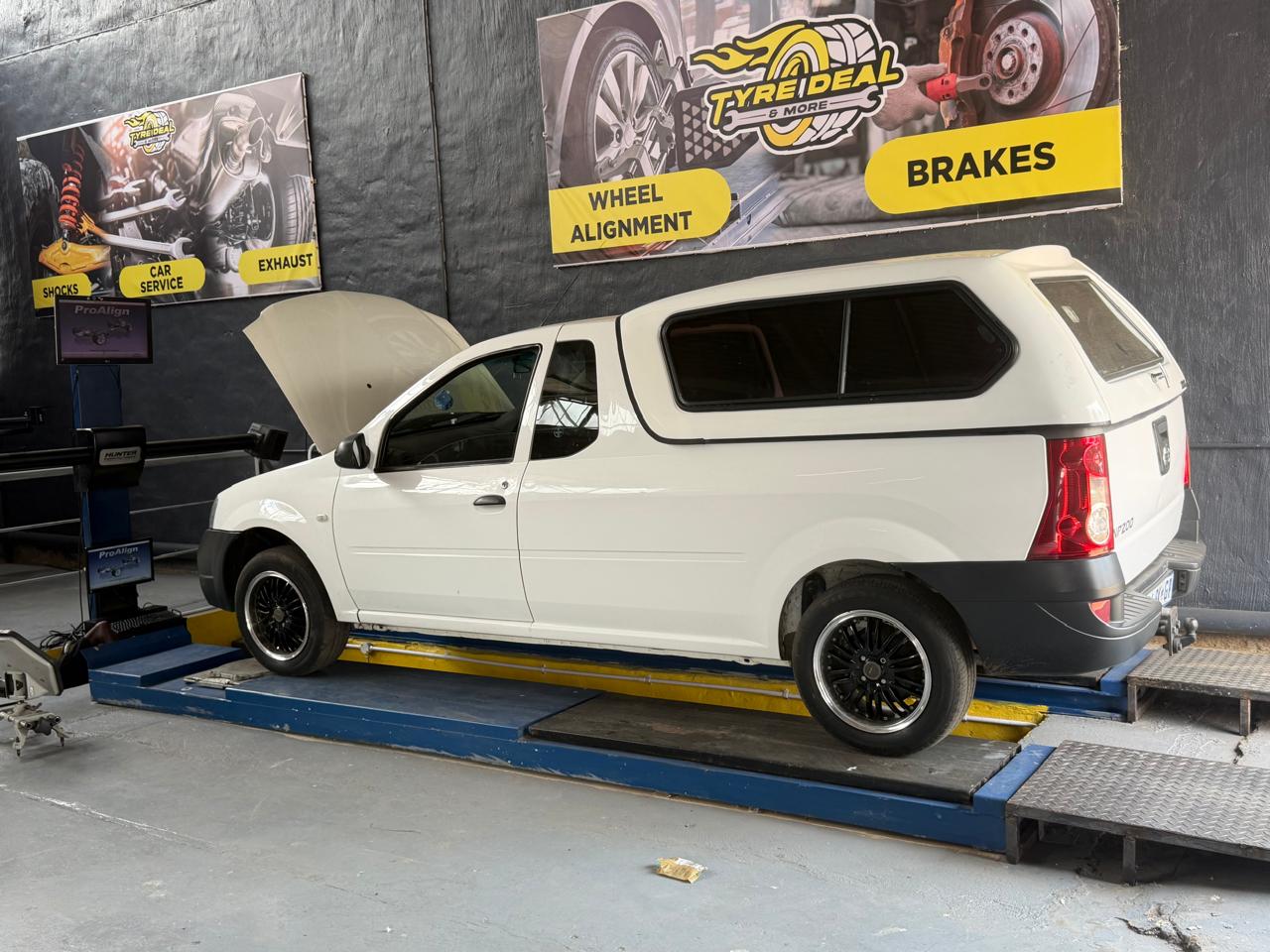 Nissan NP200 on alignment ramp with Hunter sensors
