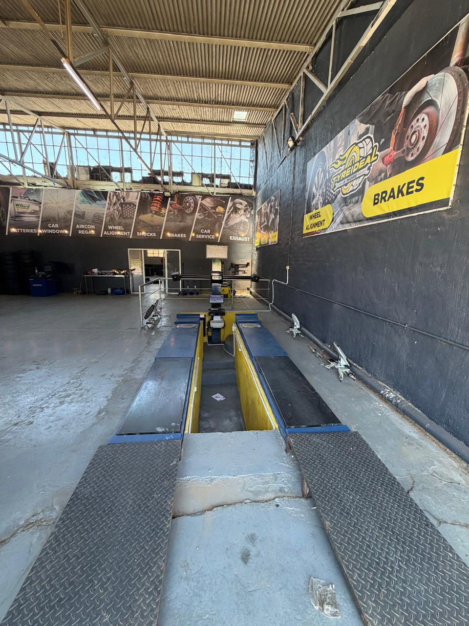 Full alignment ramp with Hunter equipment — professional workshop
