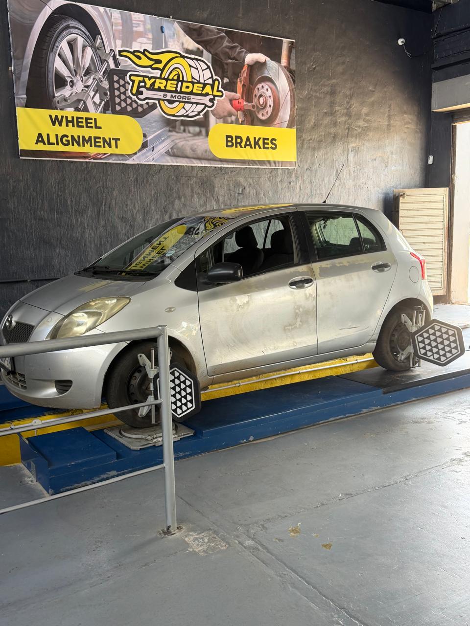 Toyota Yaris with alignment sensors attached — precision measurement